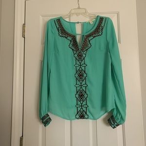 Boutique aqua top with gold/black tribal accents